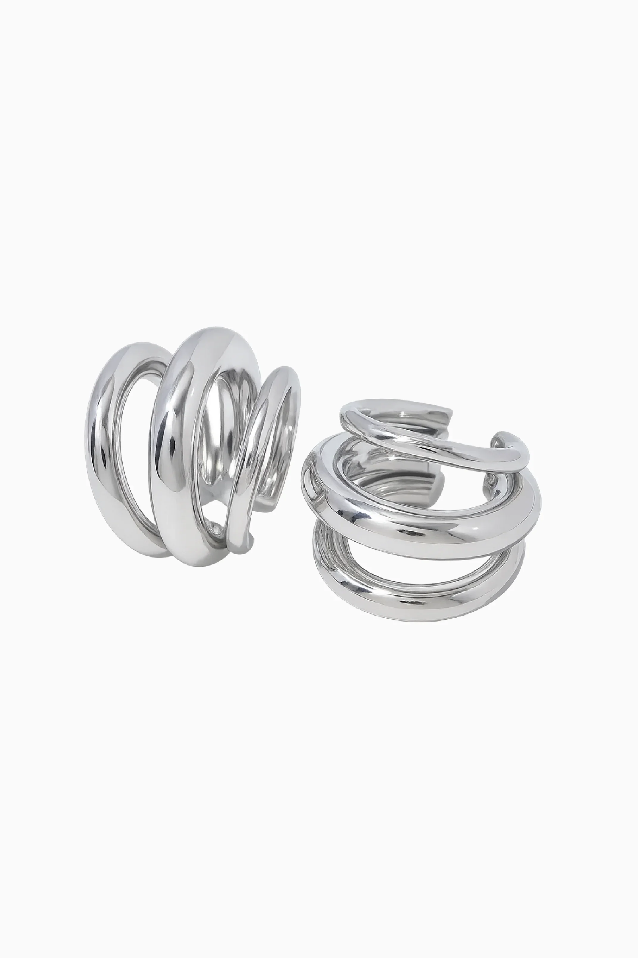 Pair of silver spiral earrings on a white background