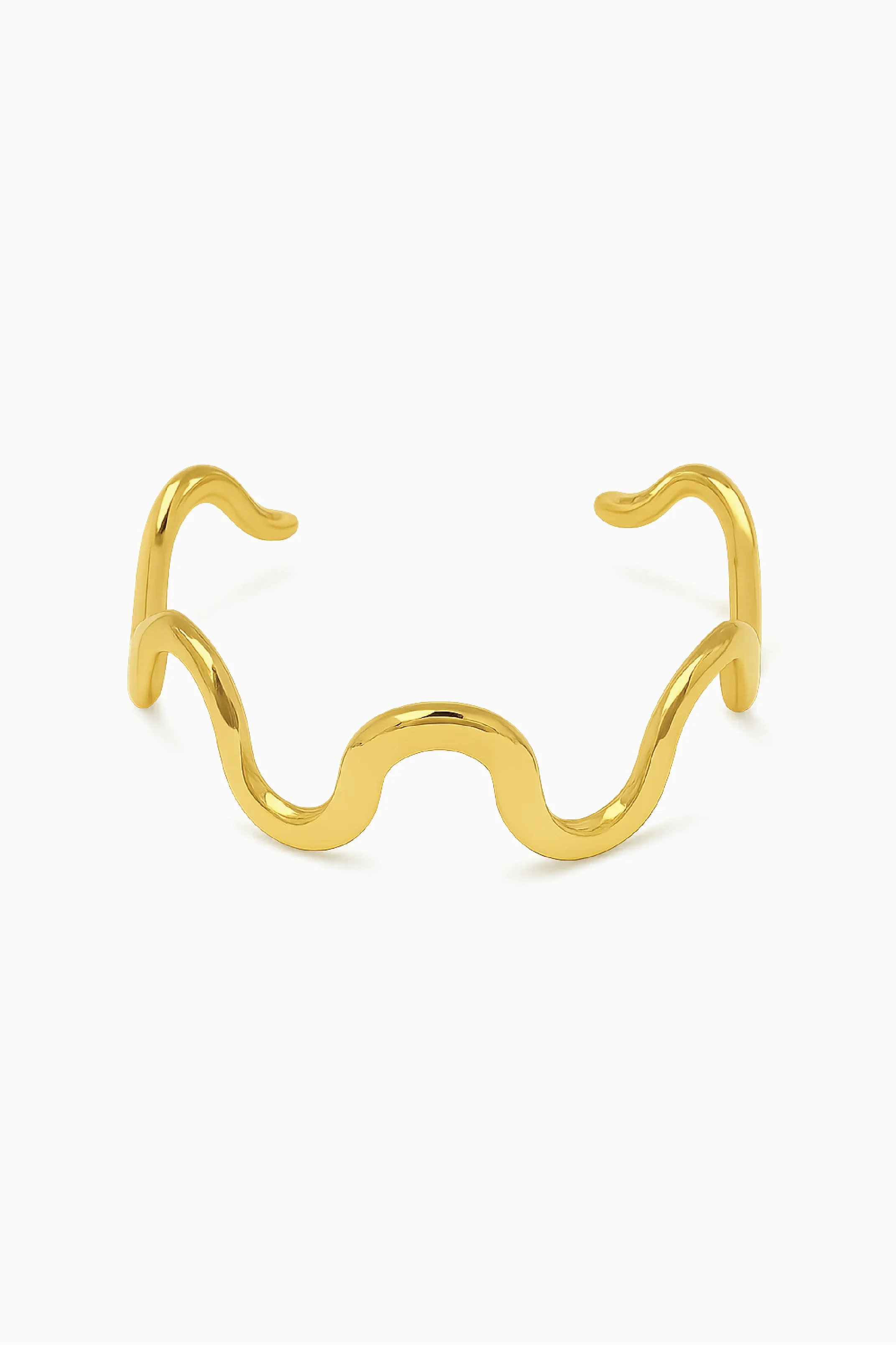 Gold cat-shaped ring on a white background