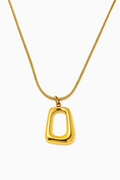 Gold necklace with a unique pendant on a white background