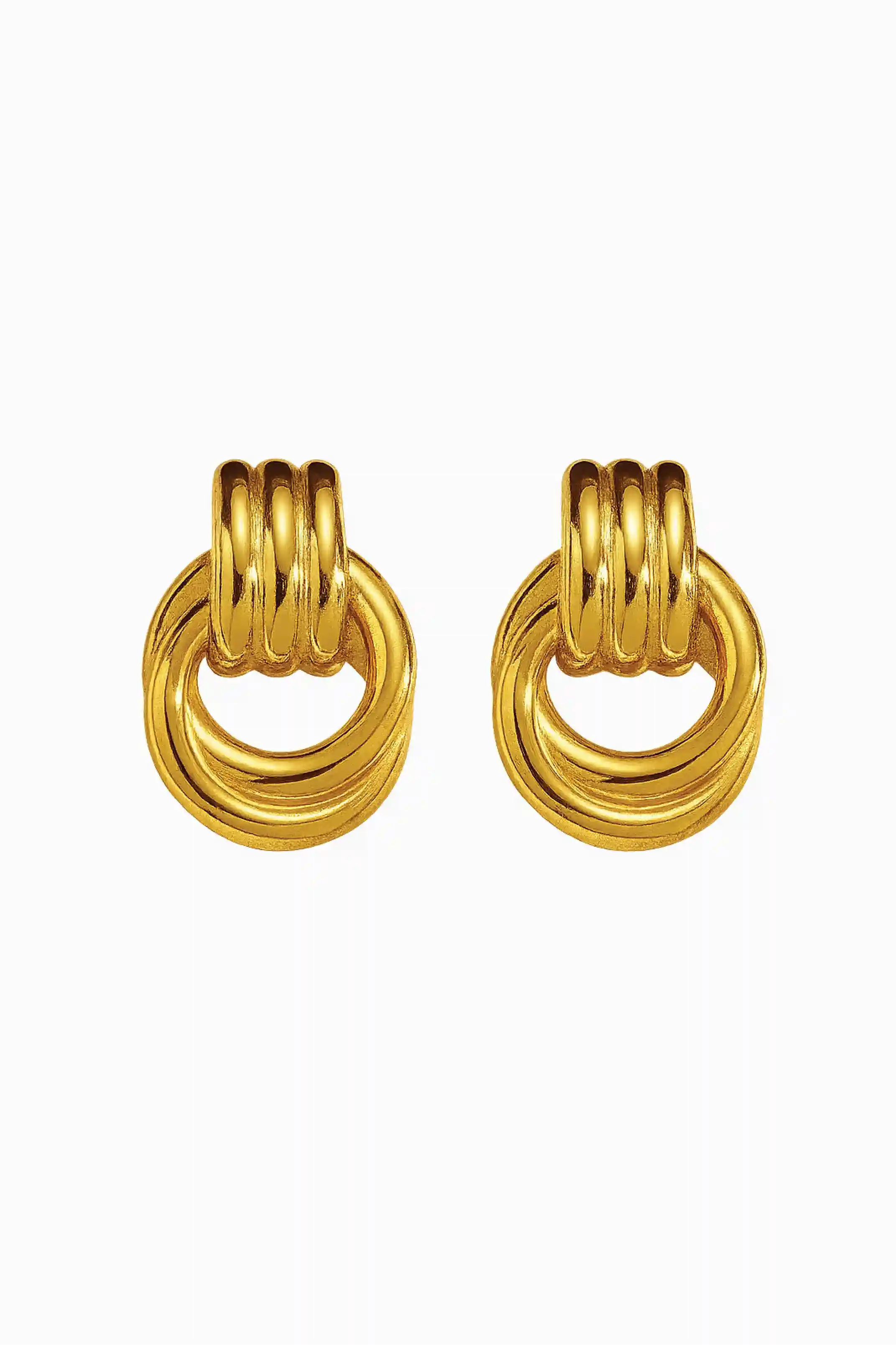 Pair of gold earrings on a white background