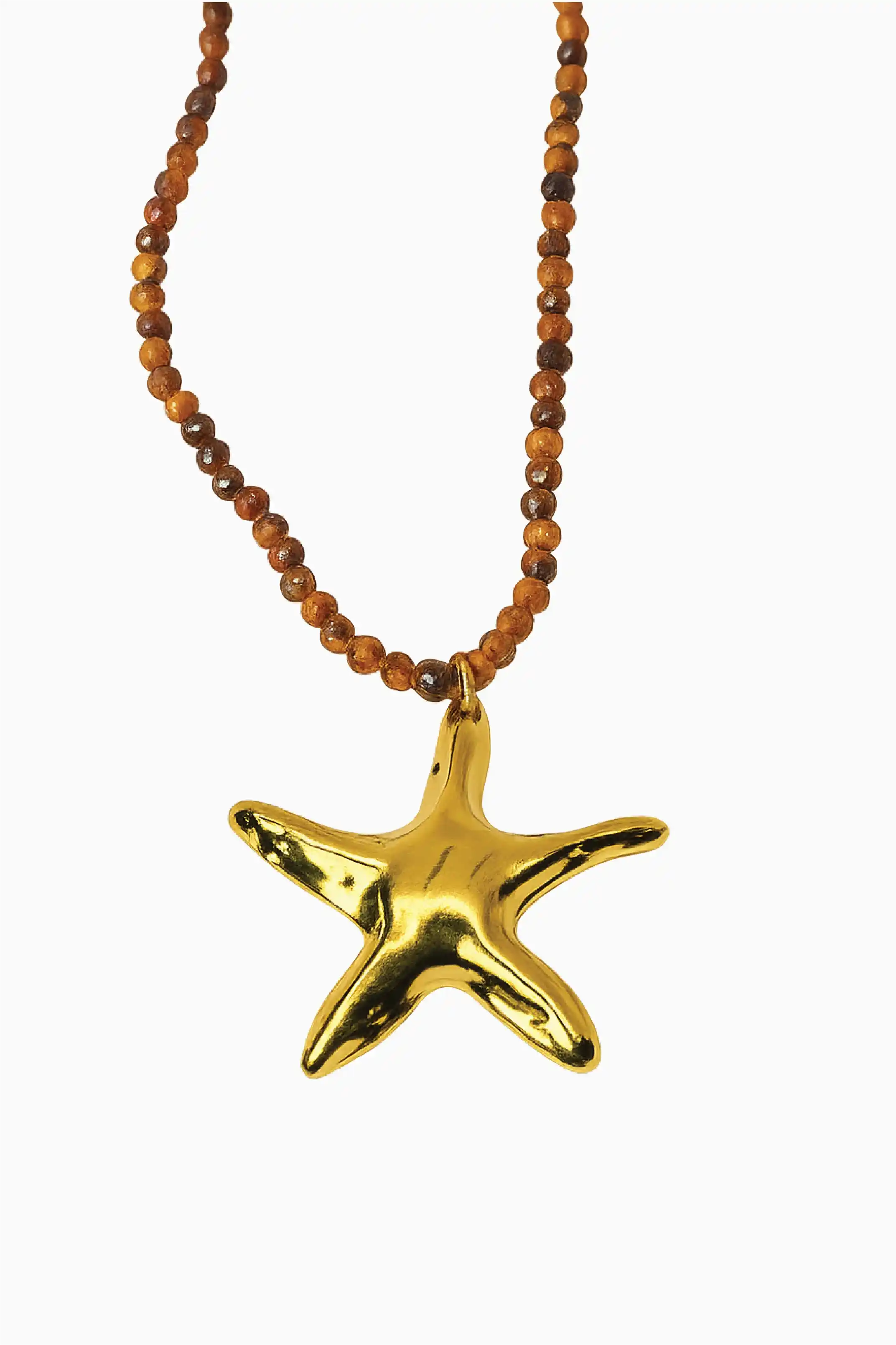 Gold starfish pendant on a beaded necklace against a white background